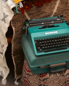 pexels photo 36392426 36392426 Classic Olivetti Studio 45 typewriter on a patterned ottoman, conveying retro vibes.